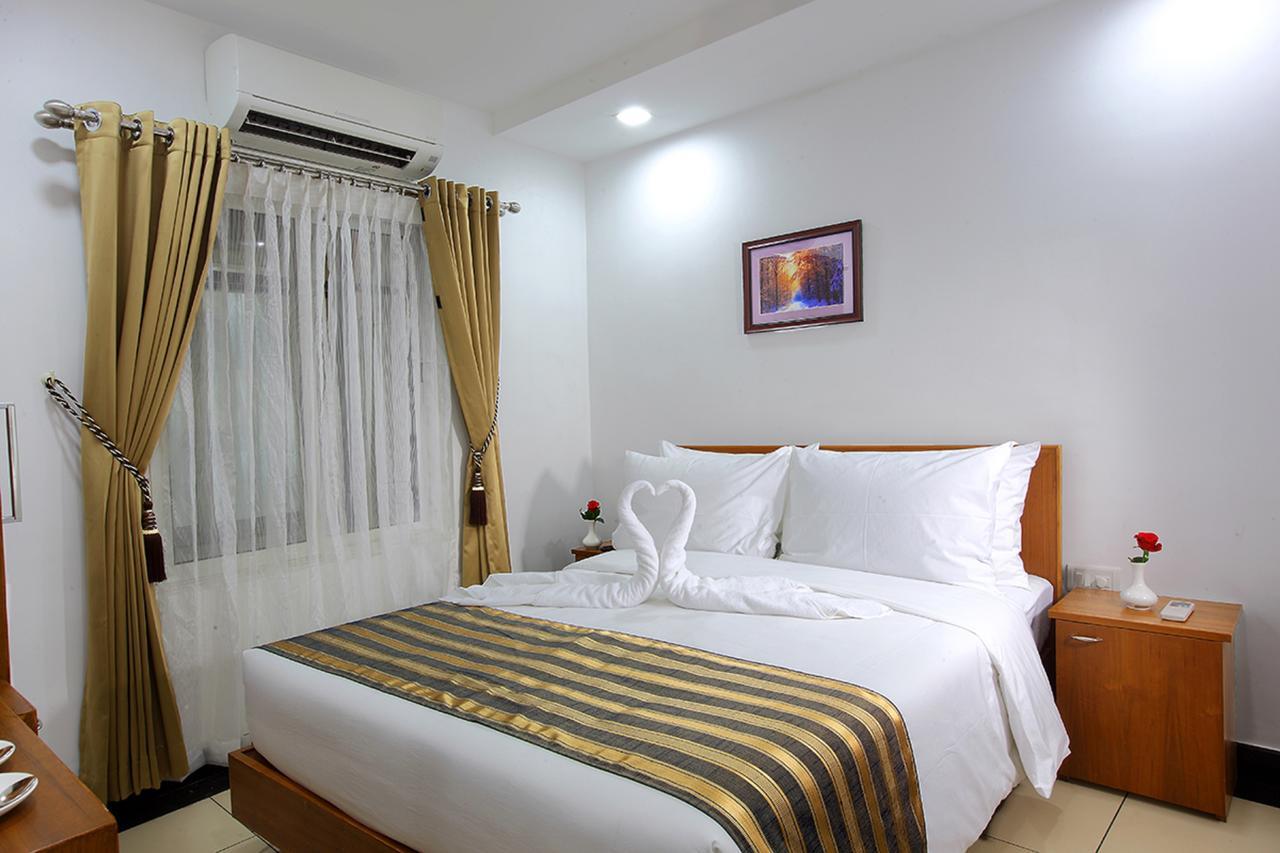 Pgs Inn Kochi Buitenkant foto